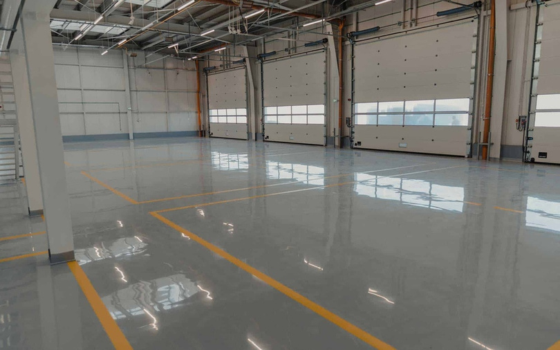 Seamless epoxy floor coating in an industrial warehouse
